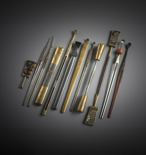 <b>A group of 11 hairpins, partly worked in silver or lacquer and metal and one finial of a hairpin</b>