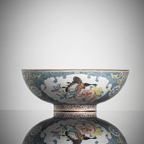 <b>A fine enamel bowl with decoration of butterflies, flowers and foliage, decorated with a lattice pattern on the outside</b>