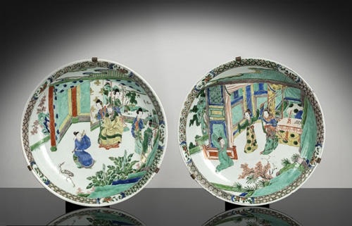 <b>A pair of 'Famille verte' plates with novel scenes in fine painting</b>