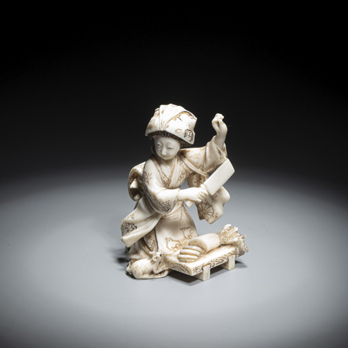 <b>A small ivory okimono of a peasant woman</b>