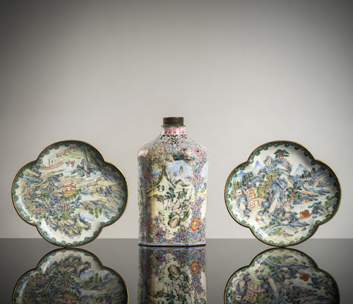 <b>A pair of lobed enamelled trays with fine decoration of landscapes and an octagonal screw-top flask with enamel decoration</b>