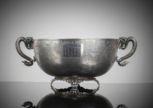 <b>A large and very finely engraved silver bowl with inscription cartouche and engraving of a seascape, houses and boats</b>