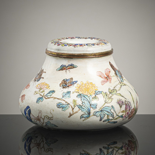 <b>A rare enamel oíl lamp with fine decoration of butterflies and flowers in bright enamel colours on a white ground</b>