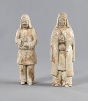<b>TWO POTTERY GUARDIAN FIGURES</b>