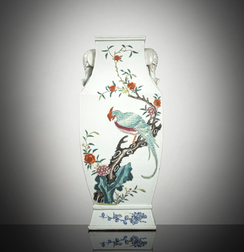 <b>A rectangular fanghu-shaped 'famille rose' porcelain vase with flowers and birds decoration and elephant head handles</b> <b>A rectangular fanghu-shaped 'famille rose' porcelain vase with flowers and birds decoration and elephant head handles</b>
