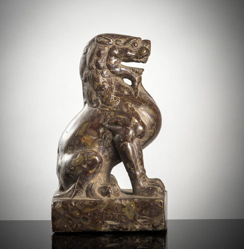 <b>A carved lion of so-called. Puddingstone' on a plinth</b>