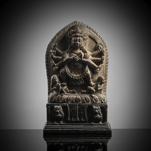 <b>A carved stone figure of Bhairava on a throne</b>
