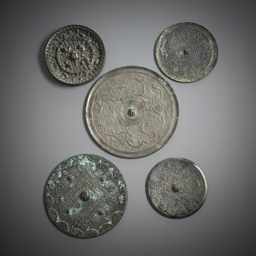 <b>A group of six bronze mirrors, including two grape-lion mirrors with silver</b>