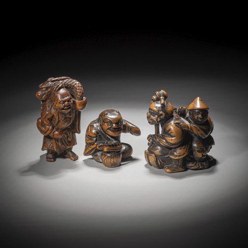 <b>Three carved boxwood netsuke</b>
