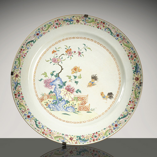 <b>An export porcelain 'famille rose' porcelain charger with roosters in a garden</b> <b>An export porcelain 'famille rose' porcelain charger with roosters in a garden</b>