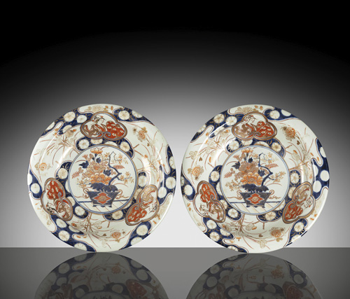 <b>A pair of deep 'imari' porcelain plates with flower pot decoration</b>