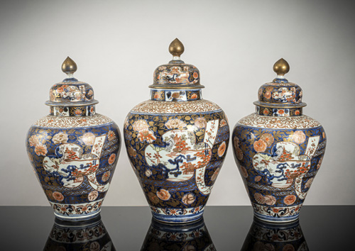 <b>A pair of lidded 'imari' porcelain vases and a larger lidded vase</b>