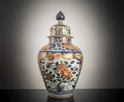 <b>A large 'imari' porcelain vase with cover with decoration of peonies, chrysanthemums, prunus branches, and shishi</b>