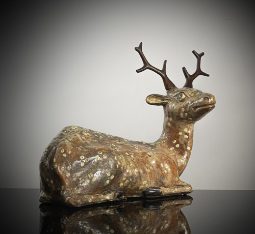 <b>A very rare model of a reclining deer</b>