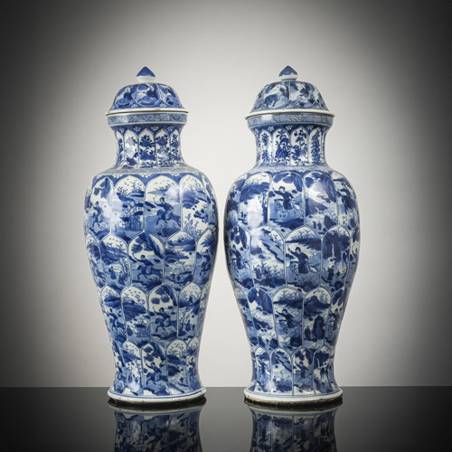 <b>A pair of blue and white porcelain vases and covers with landscapes in cartouches</b>