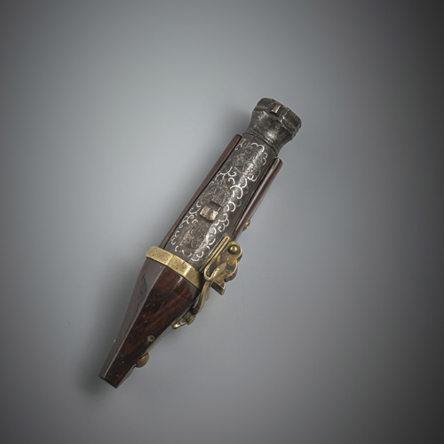 <b>A RARE NETSUKE OF A MINIATURE TANEGASHIMA TEPPO (RIFLE)</b>