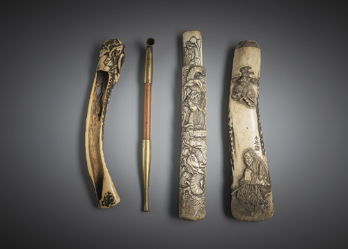 <b>Three pipe cases made of staghorn, including a dragon and a dairymaid and a pipe</b>