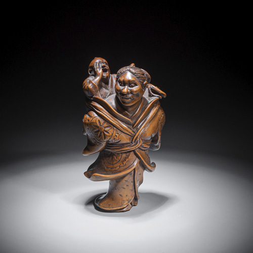 <b>A carved boxwood okimono of an onibaba with baby made of boxwood</b>