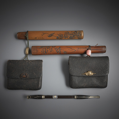 <b>Two bamboo pipe holders and two tobacco pouches with fine kanemono, one pipe</b>
