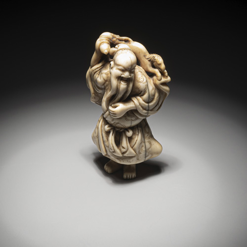<b>A carved ivory netsuke of the laughing Chôkarô Sennin</b>