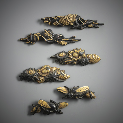 <b>Three pairs of shakudô menuki with gold details</b>