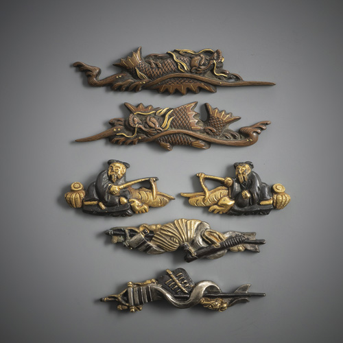 <b>Three pairs of menuki in shakudô and copper with gold details</b>