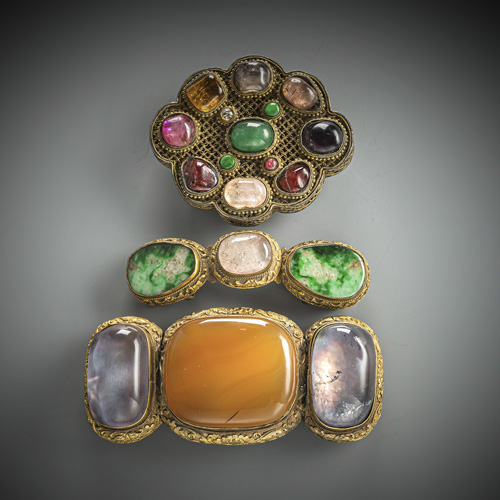 <b>Three belt buckles partly in fire-gilt bronze set with stones, including jadeite, agate, semi-precious stones and glass</b>