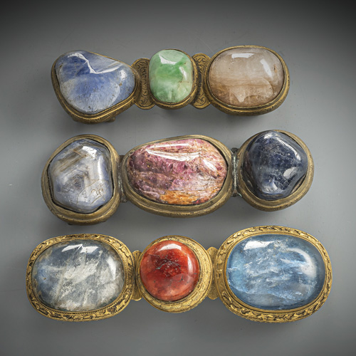 <b>Three belt buckles in fire-gilt bronze set with semi-precious and precious stones</b>