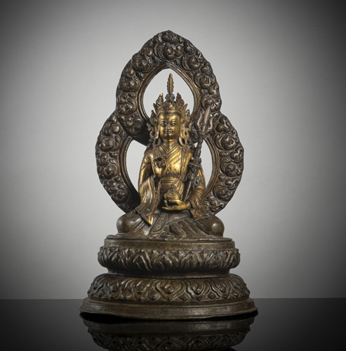 <b>A partially gilded copper repoussé figure of Padmasambhava</b>