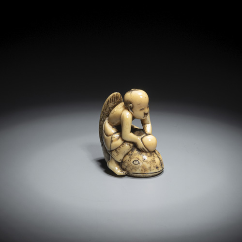 <b>A group of three netsuke made of maritime ivory, including a boy with a tama on a catfish</b>