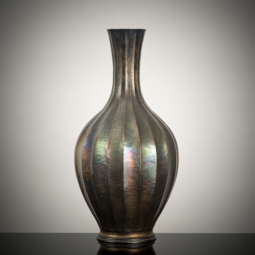 <b>A lobbed silver vase with iridescent patina</b>