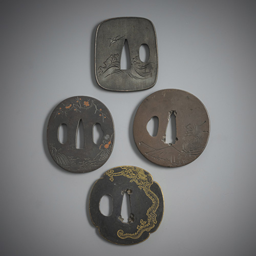 <b>Four tsuba: three in shakudo and one in shibuichi</b>