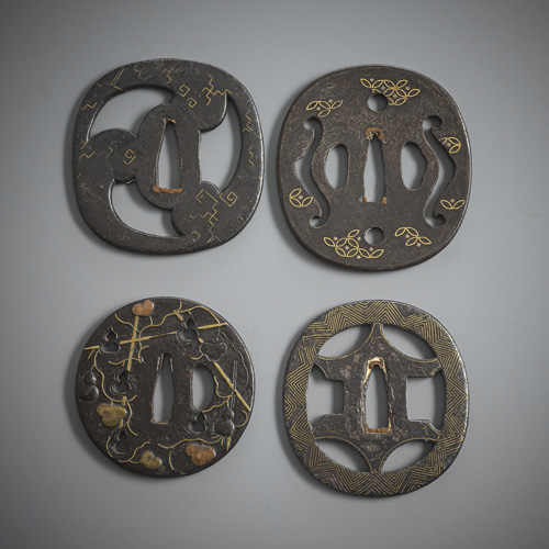 <b>Four tsuba with inlays, partly sentoku</b>