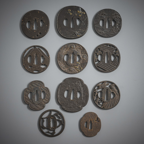 <b>A group of eleven iron tsuba, some with details in gold</b>