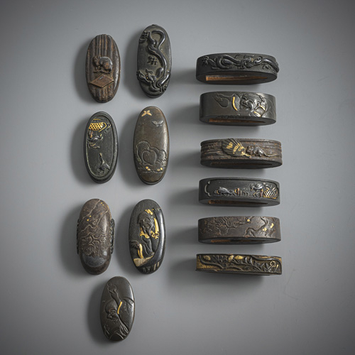 <b>A group of six fuchi-kashira, partly worked in shakudo and iron respectively, partly</b>