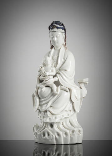 <b>A dehua figure of a Guanyin and child</b>