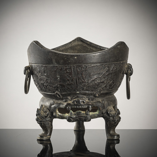 <b>A rare archaistic relief bronze censer on three maskaron head feet</b> <b>A rare archaistic relief bronze censer on three maskaron head feet</b>