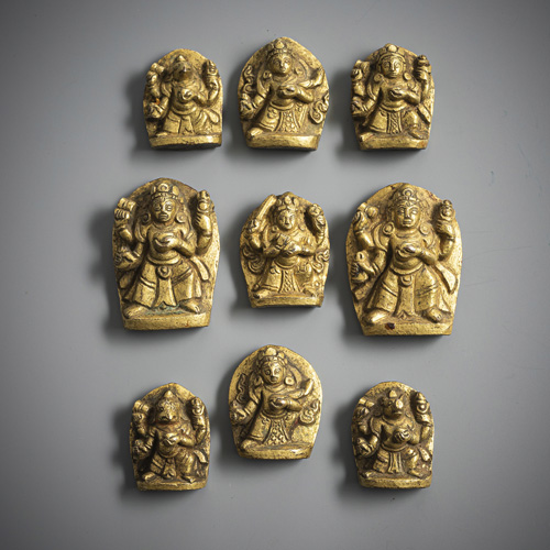 <b>A group of nine gilt-bronze amulets</b>