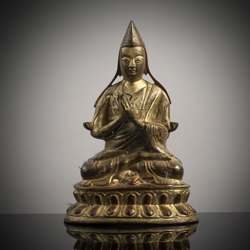 <b>A gilt-lacquered  bronze figure of a lama</b>