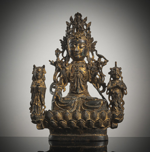<b>A bronze group of Guanyin flanked by a pair of worshippers</b>
