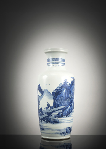 <b>A blue and white porcelain rouleau vase with riders in a mountain landscape</b>