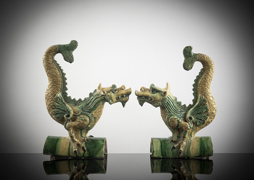 <b>A pair of rare 'sancai'-glazed roof tiles in the shape of dragons with fish fins</b>