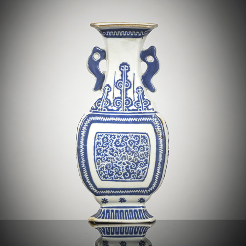 <b>A fine porcelain wall vase with dark blue enamel decoration of lotus and foliage applied in relief</b>
