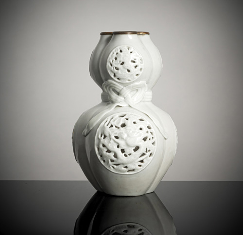 <b>A rare tripple porcelain calabash vase with a decoration of pierced dragon medallions and a band</b>