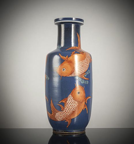 <b>A powder blue glazed porcelain rouleau vase with large carp in orange-red with aquatic plants in enamel colours</b>