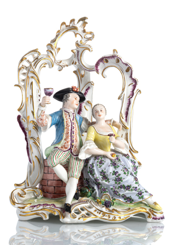 <b>A NYMPHENBURG PORCELAIN GROUP OF A WINE DRINKING COUPLE IN A PERGOLA</b> <b>A NYMPHENBURG PORCELAIN GROUP OF A WINE DRINKING COUPLE IN A PERGOLA</b>