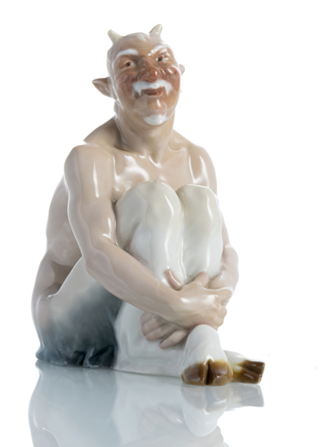 <b>A MEISSEN PORCELAIN FIGUE OF A SEATED FAUN</b> <b>A MEISSEN PORCELAIN FIGUE OF A SEATED FAUN</b>