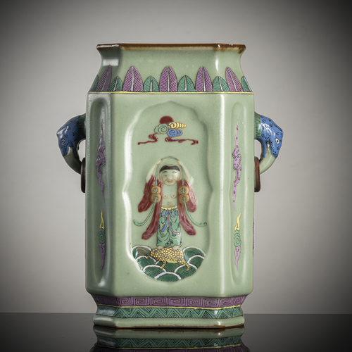 <b>A celadon-glazed octaginal vase with molded decoration of Li Tieguai and clouds</b>
