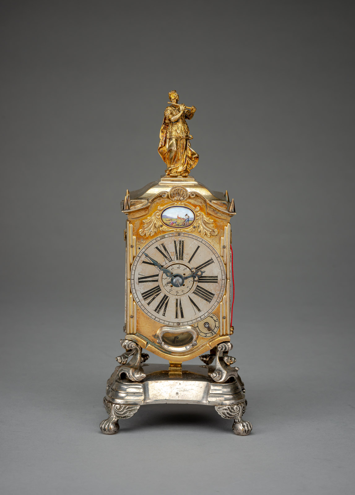 <b>AN IMPORTANT GERMAN GILTBRASS AND SILVERED BAROQUE TABLE CLOCK</b>