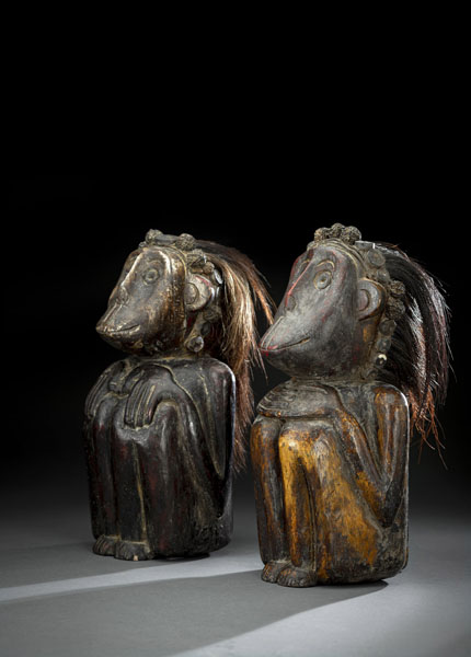 <b>A PAIR OF CARVED WOOD FIGURES TRIMMED WITH REAL HAIR  WITH ORNAMENTAL HEAD BANDS PARTIALLY MADE OF RUDRAKSHA BEADS</b>